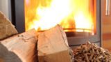a woodburning stove with wood and pellets